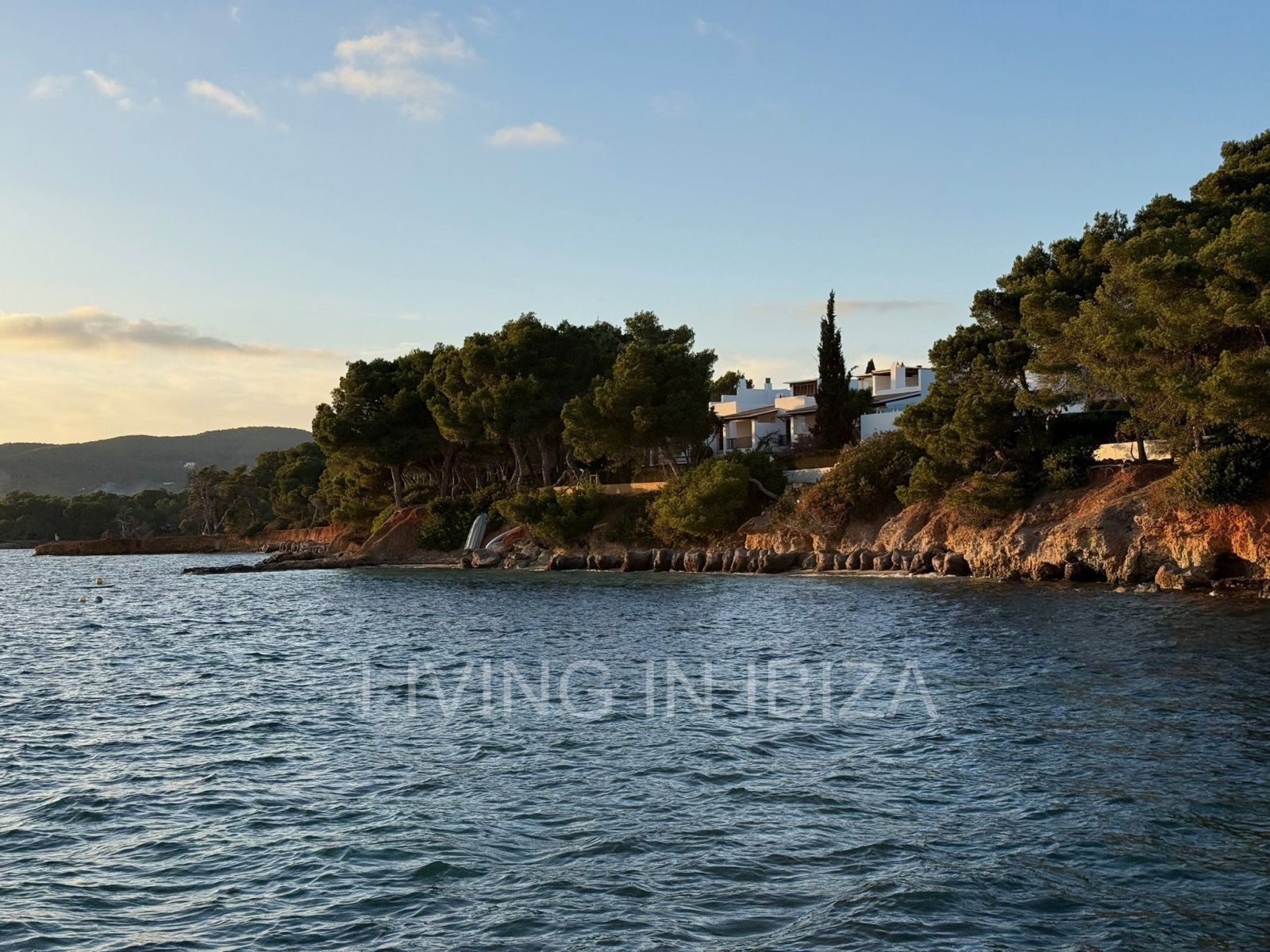 Seasonal rental. Mediterranean elegance in a privileged setting within a seafront residential community in Santa Eulalia del Río, Ibiza.