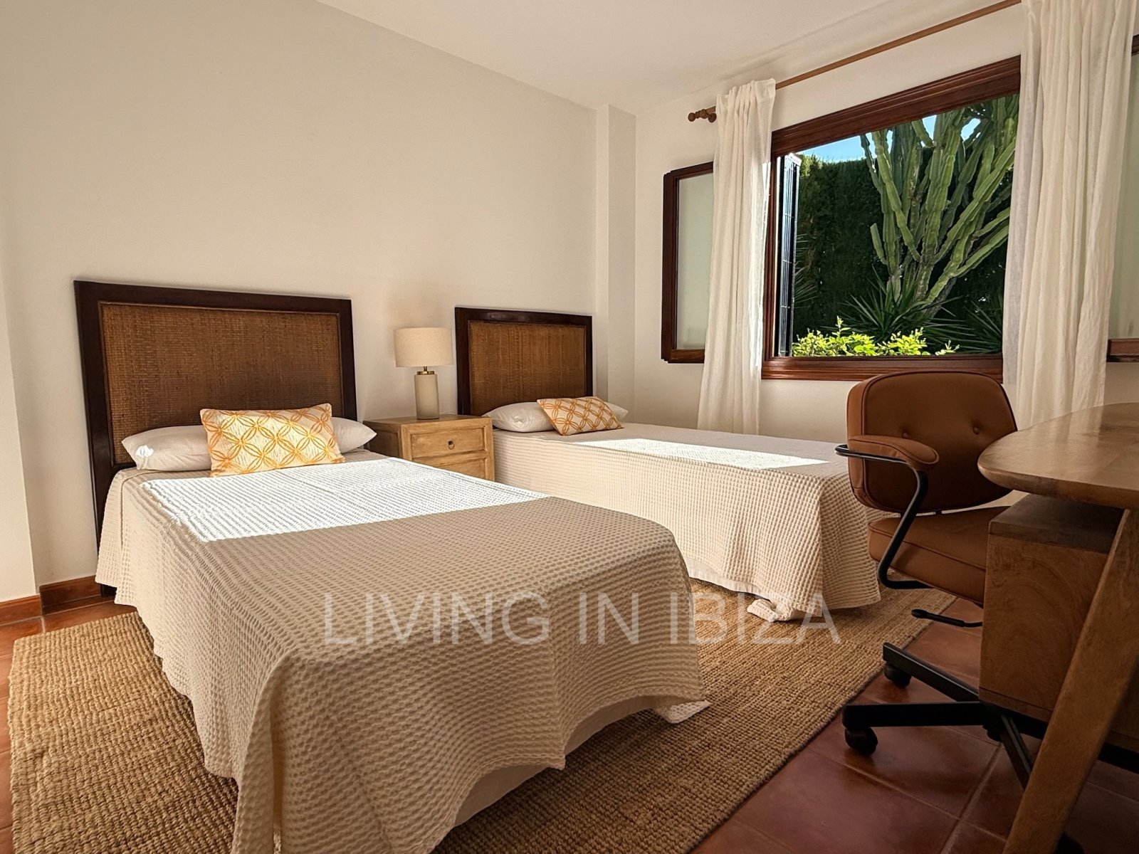 Seasonal rental. Mediterranean elegance in a privileged setting within a seafront residential community in Santa Eulalia del Río, Ibiza.