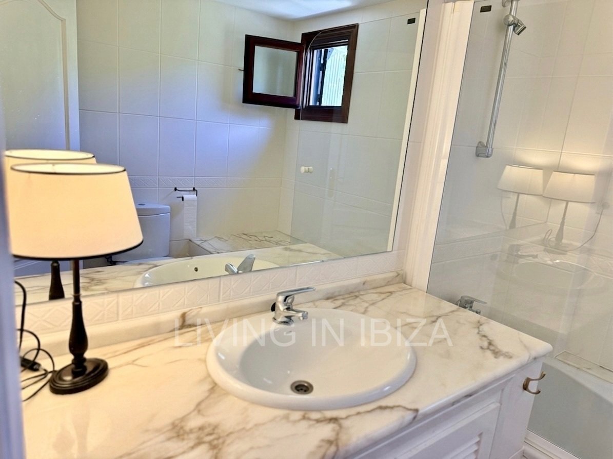 Seasonal rental. Mediterranean elegance in a privileged setting within a seafront residential community in Santa Eulalia del Río, Ibiza.