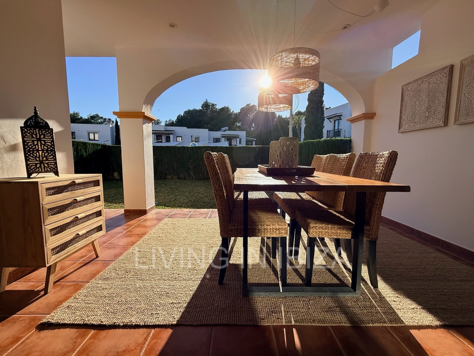 Seasonal rental. Mediterranean elegance in a privileged setting within a seafront residential community in Santa Eulalia del Río, Ibiza.