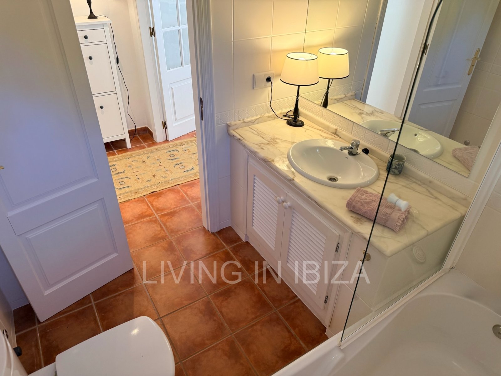 Seasonal rental. Mediterranean elegance in a privileged setting within a seafront residential community in Santa Eulalia del Río, Ibiza.