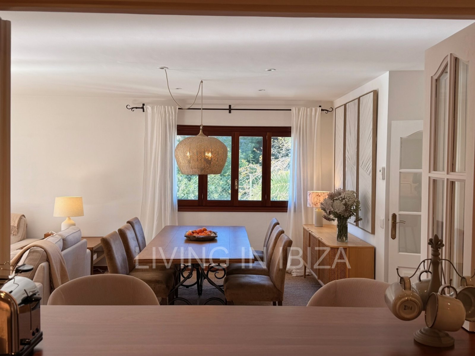 Seasonal rental. Mediterranean elegance in a privileged setting within a seafront residential community in Santa Eulalia del Río, Ibiza.