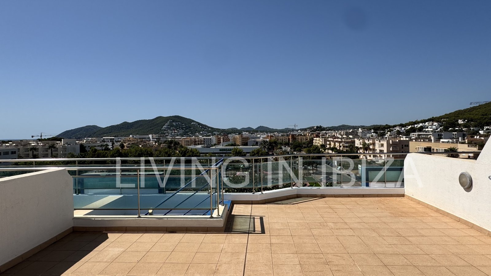 Penthouse for Sale in Santa Eulalia del Río, Ibiza – 100 m² of Terraces, Private Rooftop, Jacuzzi and Large Communal Pool