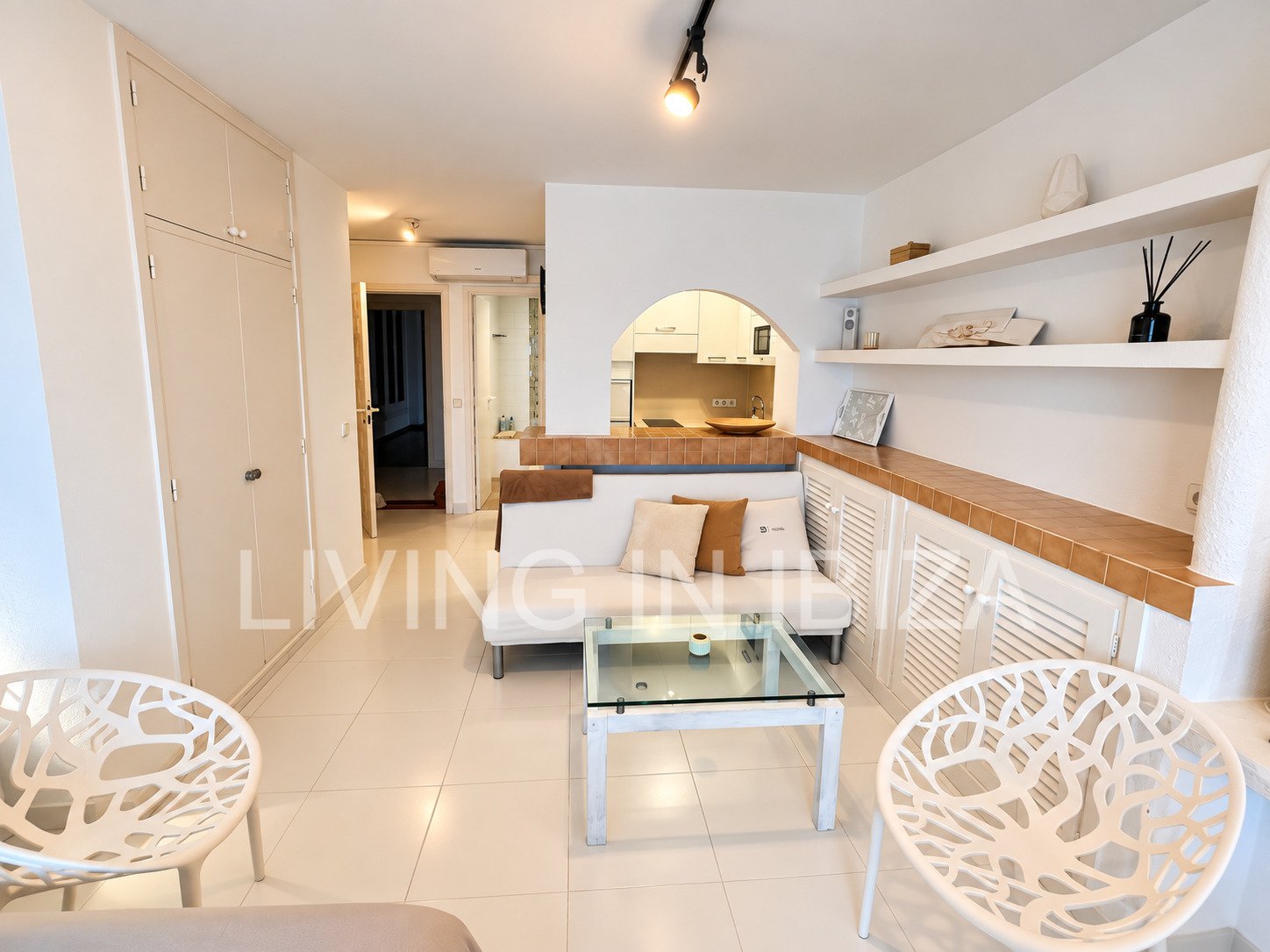 Seasonal temporary rental, cozy studio apartment with sea views on first line on promenade of Santa Eulalia del Rio, Ibiza.
