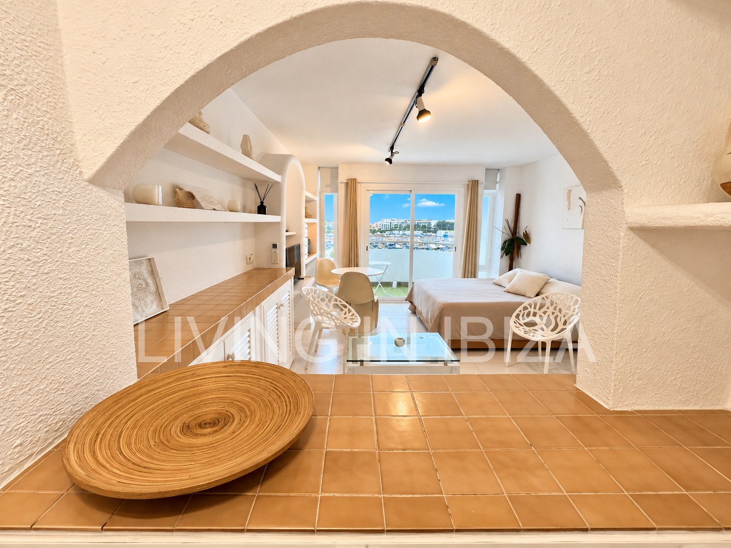 Seasonal temporary rental, cozy studio apartment with sea views on first line on promenade of Santa Eulalia del Rio, Ibiza.
