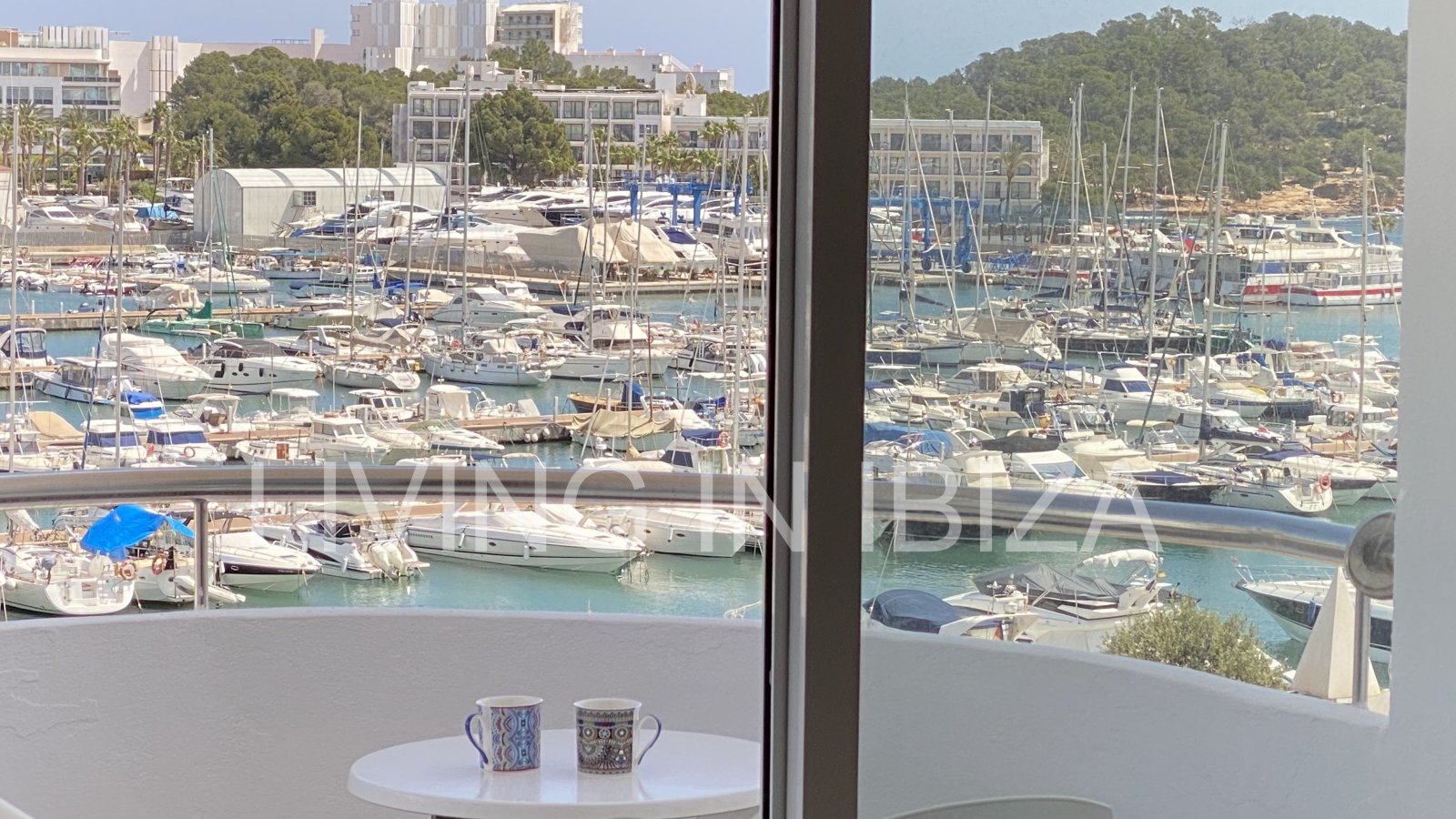 Seasonal temporary rental, cozy studio apartment with sea views on first line on promenade of Santa Eulalia del Rio, Ibiza.